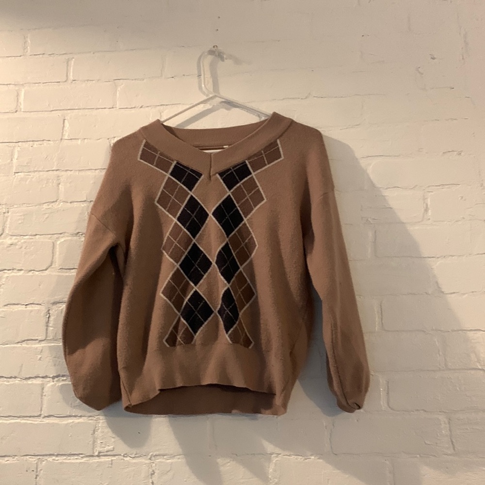 we are selling a brown sweater vest cardigan